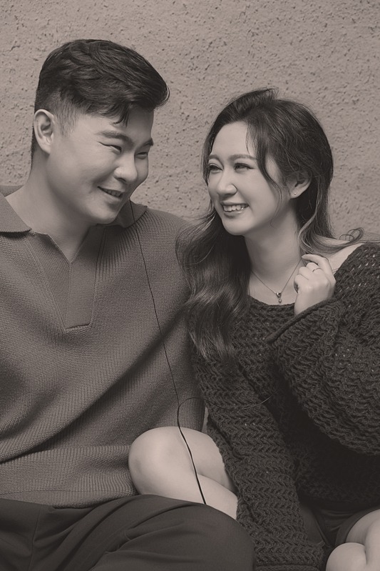 Dylan and Steven smiling at each other